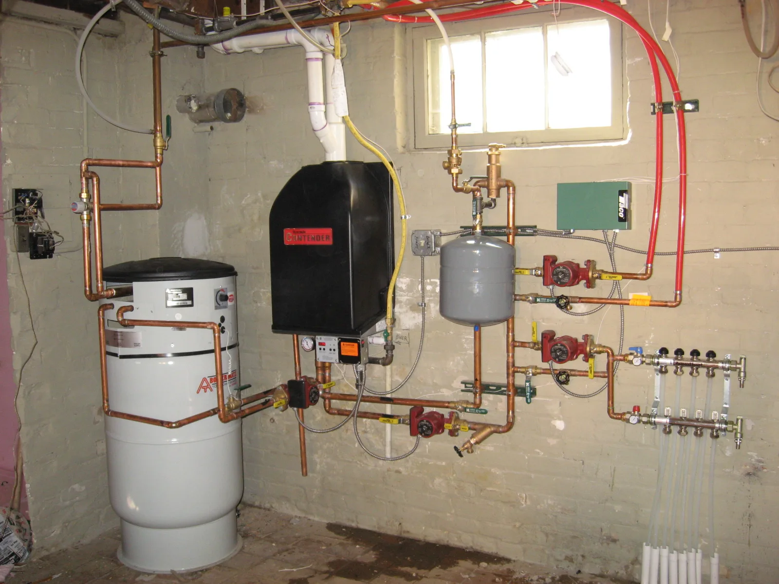 Real residential hydronic boiler, pumps, expansion tank, and manifolds